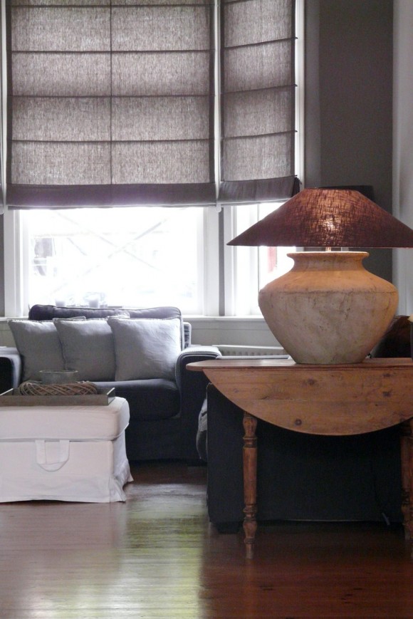 Grey linen rollers warm living room